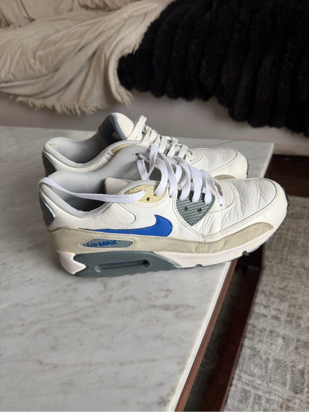 Nike men size 10 White Leather Sneakers with Blue Swoosh and Gray Accents